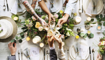 People Cling Wine Glasses on Wedding Reception with Bride and Groom